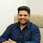 ananya Office scene with a man in a blue shirt.